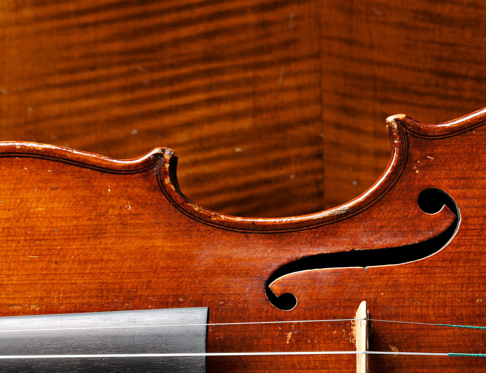 Calvin Baker Violin and Back of a John Juzek Cello Calvin Baker Violin and Back of a John Juzek Cello