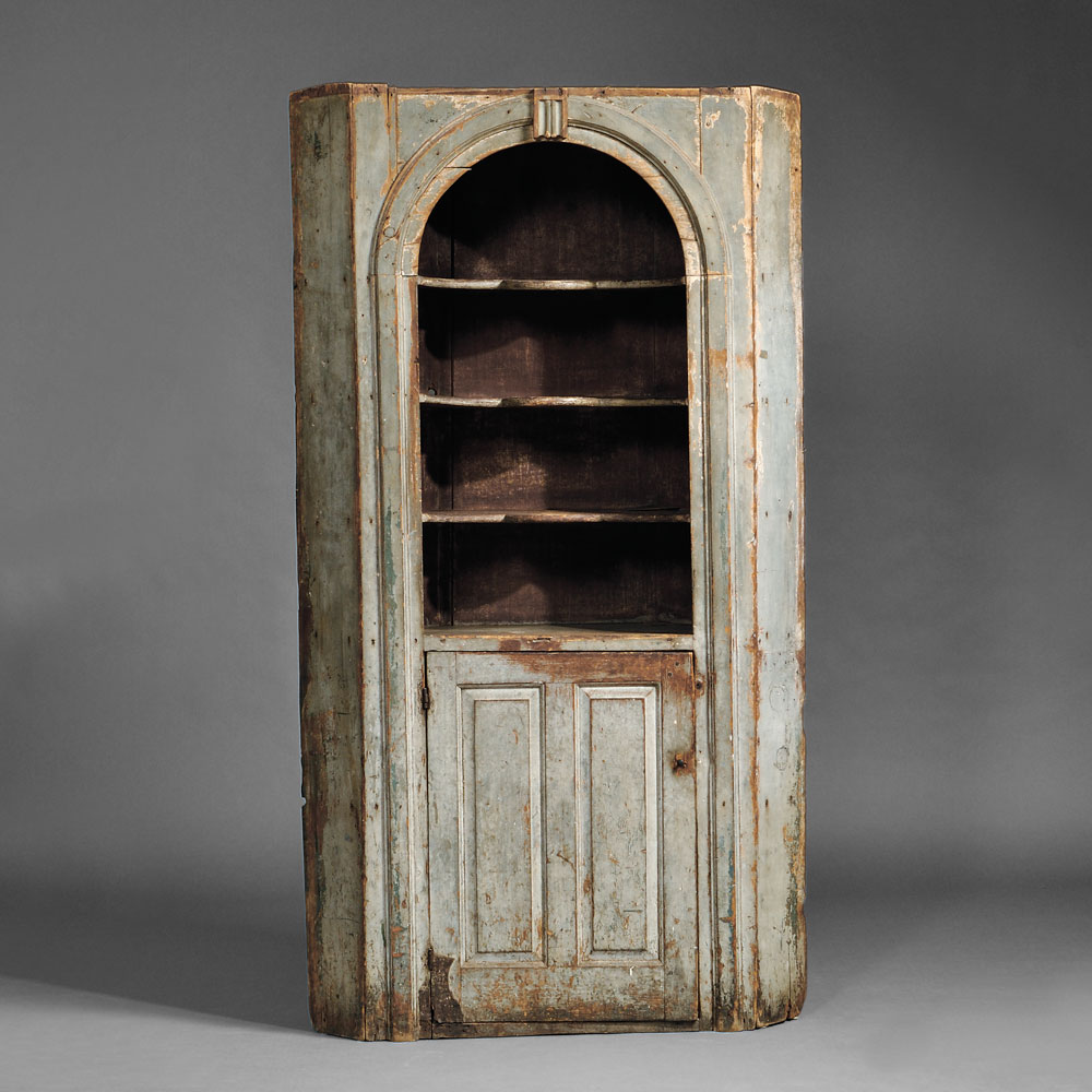 Blue-painted Pine Corner Cupboard, probably New Hampshire, mid- 18th century (Lot 308, Estimate $20,000-$30,000)